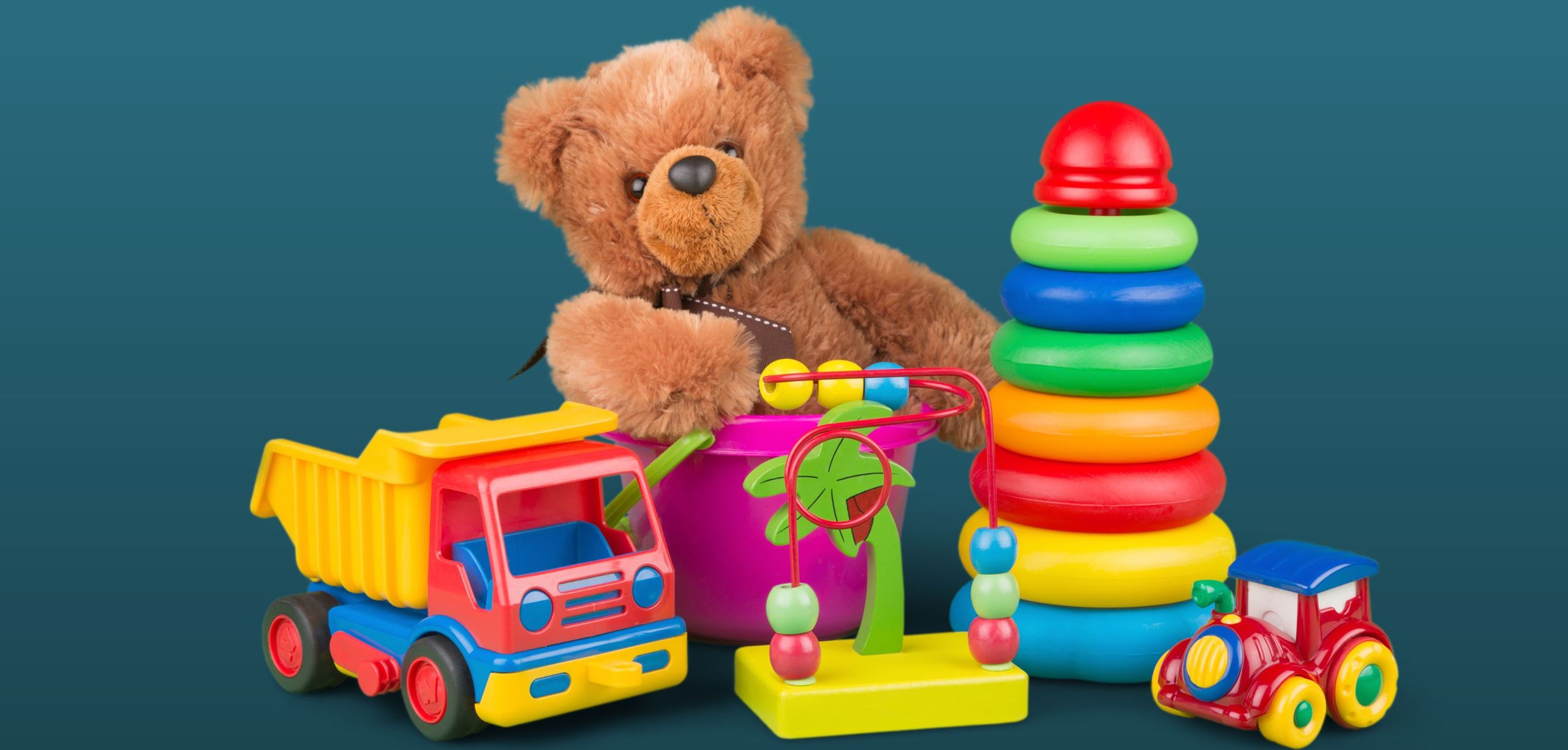 Teddy bear and toy truck with other various toddler toys
