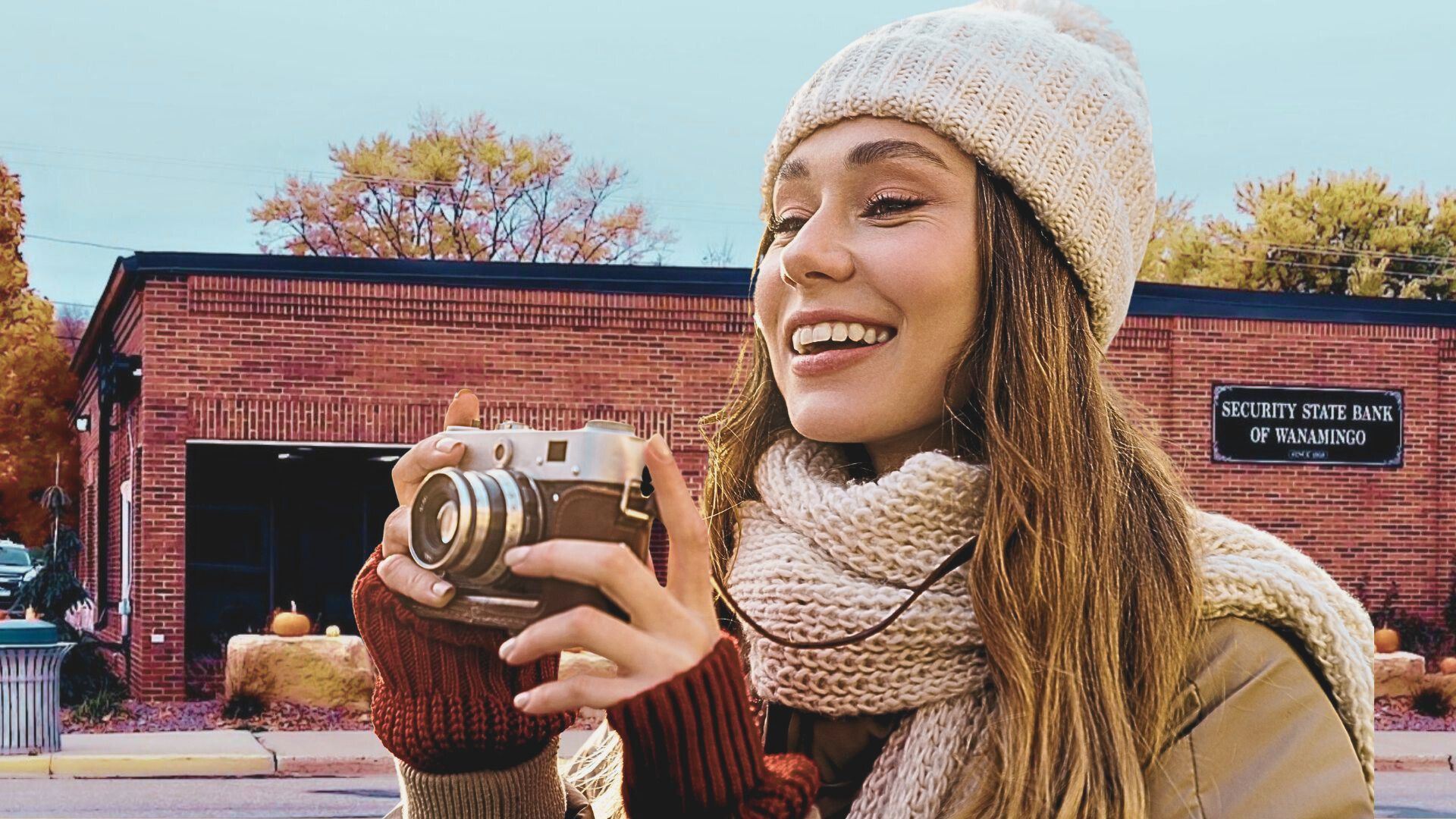 Young woman holding a camera