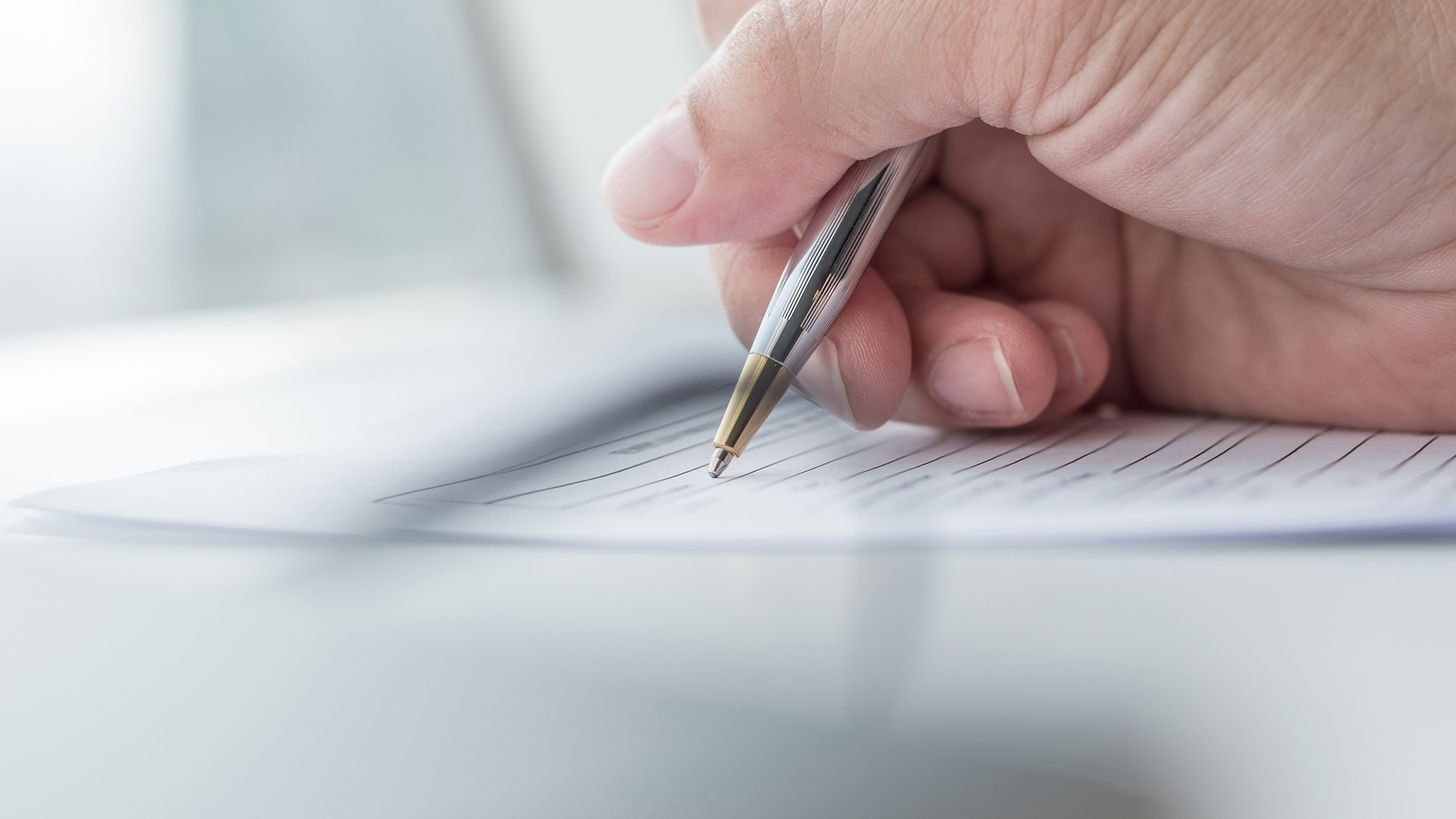 Applicant filling in business company application form document applying for job, or registering claim for health