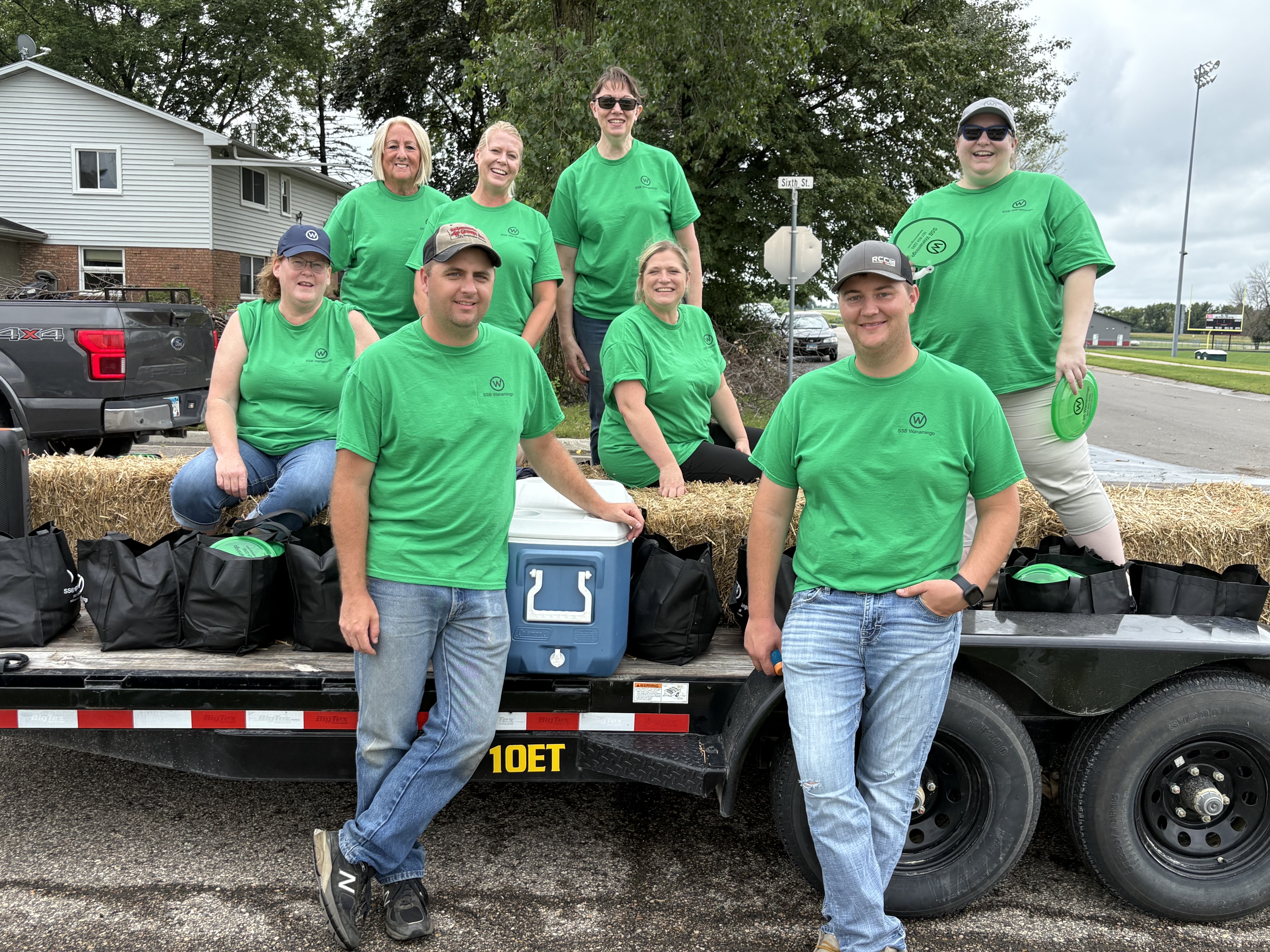 Group standing on parade float