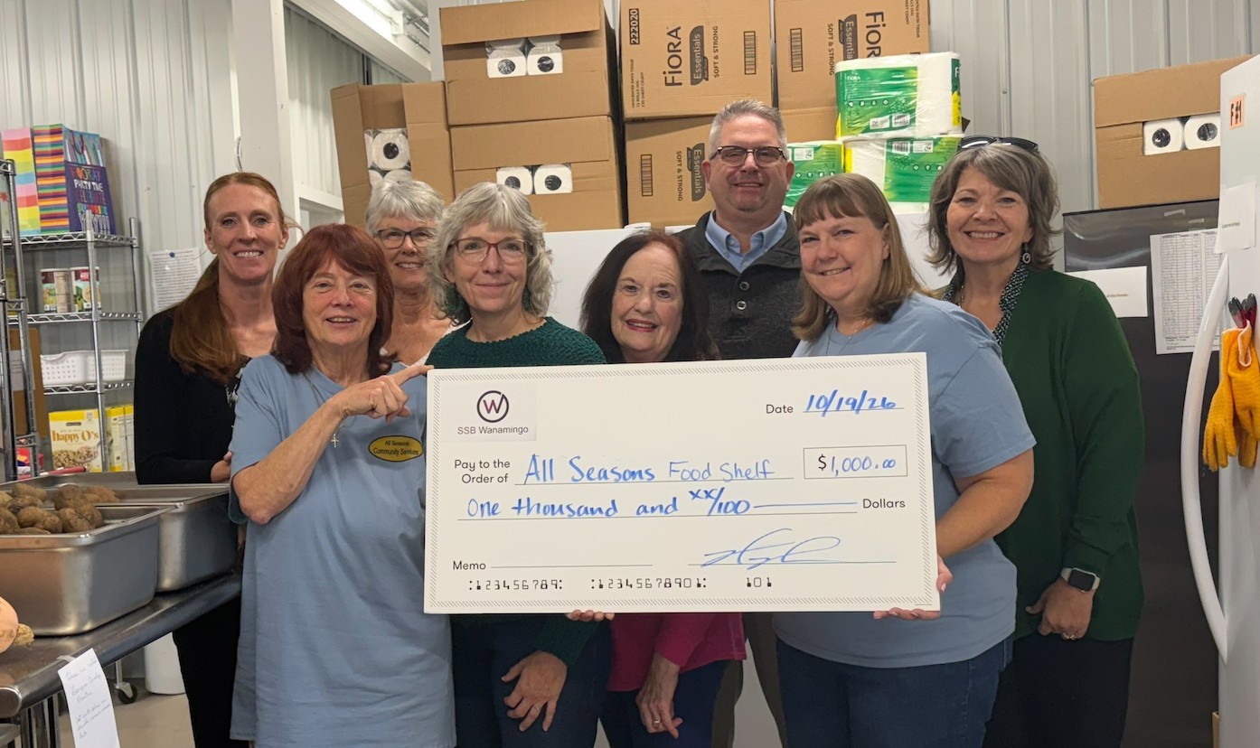 Group photo posing with large check